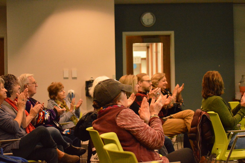 A large group of attendees applauding Danielle SeeWalker on Nov. 10 at Koelbel Library.